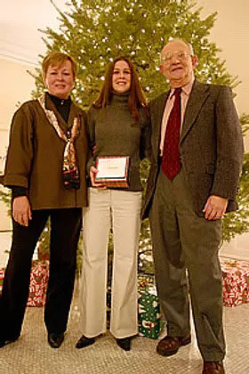 2005 Recipients in front of a Christmas tree